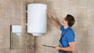 plumber inspecting a water heater