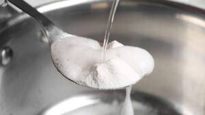 baking soda and vinegar on a spoon